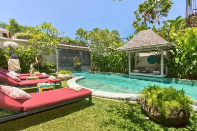 a backyard with a swimming pool and a gazebo at Kevia Peaceful 3 BR Private Pool Villa in Seminyak
