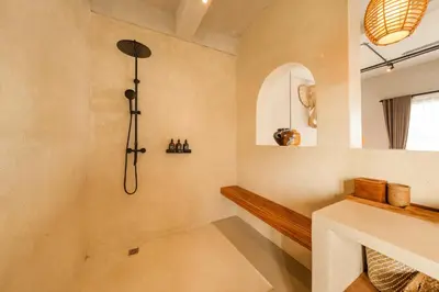 a bathroom with a shower and a sink at Modern 1BR Villa with Private Pool in Kerobokan