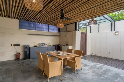a dining room with a table and chairs at Springleaf Villa in Nusa Dua