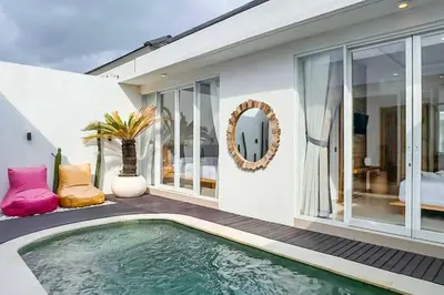 a house with a swimming pool in the yard at Luxurious Semeniyak new 2BR villa with a pool in Seminyak