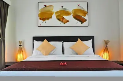 a bedroom with a large bed with at Fidela Comfortable 3 BR Private Pool Villa in Seminyak