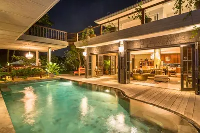a swimming pool in the backyard of a house at Kalysta Spacious 4 BR Private Pool Villa in Canggu
