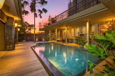 a swimming pool in the backyard of a house at Kalysta Spacious 4 BR Private Pool Villa in Canggu