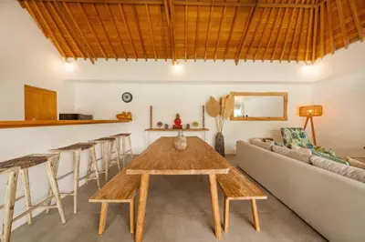 a living room with a couch and a table at Tropical 2BR Pool Villa near Seminyak & Canggu in Kerobokan