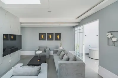 a living room with a couch and a table at Xxtra Villa in Seminyak