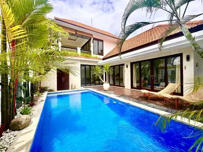 a swimming pool in front of a villa at Canggu 3BR Private Pool Villa 3 min to Beach Finns in Canggu