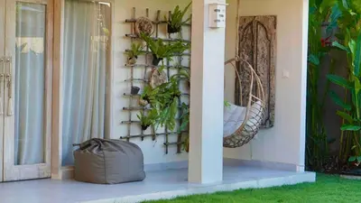 a house with plants on the wall at Villa Marina in Canggu