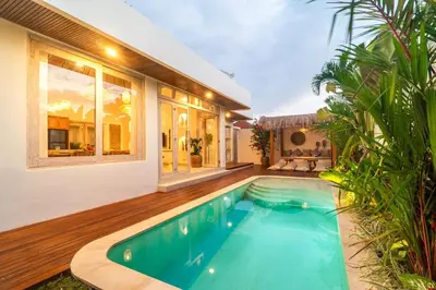 a swimming pool in the backyard of a house at NEW Villa Chim Chim Modern 2BR Tropical with Pool in Seminyak