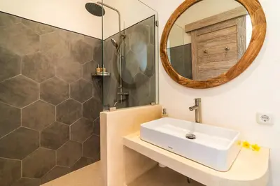 a bathroom with a sink and a mirror at NEW Villa Chim Chim Modern 2BR Tropical with Pool in Seminyak