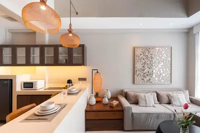 a living room with a couch and a table at Baliris Home Boutique Legian in Seminyak
