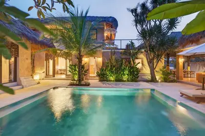 a swimming pool in front of a house at Tropical 3BR Villa Private Pool in Jimbaran in Jimbaran