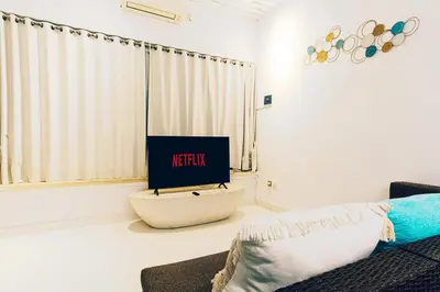a living room with a tv and a couch at Seminyak Luxe Villa Near Beach, Breakfast Concierge in Seminyak