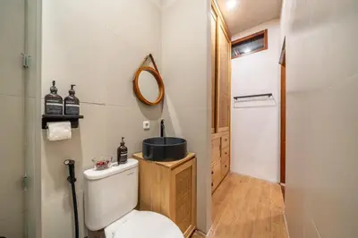 a bathroom with a toilet and a sink at 2BR Private tropical villas in Jimbaran in Jimbaran