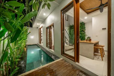 an indoor pool in a house with plants at 2BR Private tropical villas in Jimbaran in Jimbaran