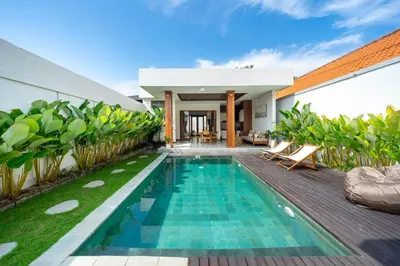 a swimming pool in the backyard of a villa at Modern 2BR Umalas Villa with Private Pool & Garden in Kerobokan