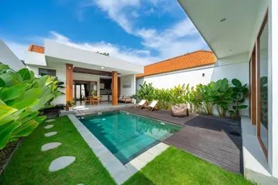 an image of a backyard with a swimming pool and a house at Modern 2BR Umalas Villa with Private Pool & Garden in Kerobokan