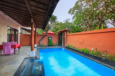 a swimming pool in the backyard of a house at 1 Bed Room Villa in Kuta Central in Kuta