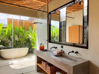 a bathroom with a tub and a sink and a bath tub at Desa Hut - Serene Tropical Hideaway Rice Fields near Seminyak in Kerobokan