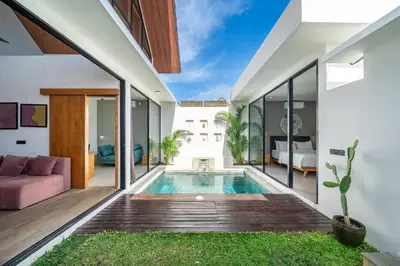 an open living room with a swimming pool in a house at Harmony A29-Peaceful 1BR Retreat in Seminyak