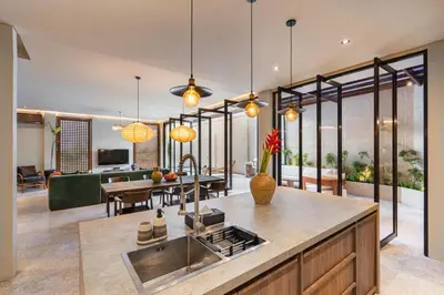 an open kitchen and living room with large windows at Konoha Villa Umalas in Mantaak