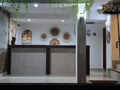 a room with a counter with plates on the wall at OKIE HOUSE HOTEL Poppies2 3 min from Kutabeach in Legian