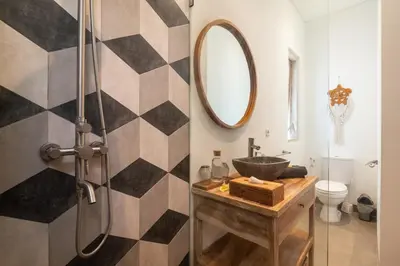a bathroom with a sink and a mirror at NEW 3BR Fleur De Vie Tranquility Villa in Seminyak in Seminyak