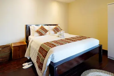 a bedroom with a bed with a teddy bear on it at 3 Bedrooms Villa with Pool WEST SANUR - Casa Del Lago in Sanur