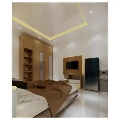 a living room with a couch and a television at Moonlit Haven in Jimbaran