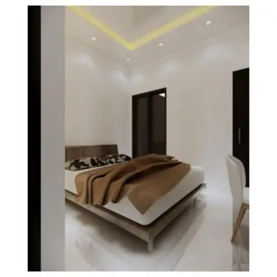 a bedroom with a bed in a white room at Moonlit Haven in Jimbaran