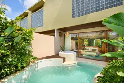 a swimming pool in the backyard of a house at Alena Cozy 1 BR Private Pool Villa With Lagoon Access in Seminyak
