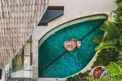 a swimming pool with a heart painted on it at Charity Stunning Grand 1 BR Pool Villa With Jacuzzi in Seminyak