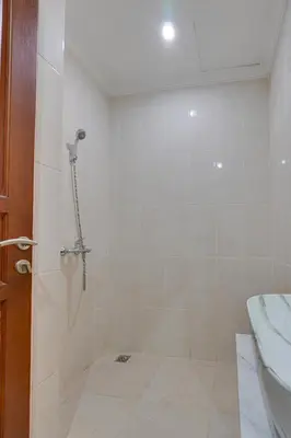a bathroom with a shower with a toilet and a sink at 3BR Villa Taman Seminyak 27 - Short Drive to Beach in Seminyak