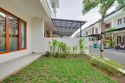 a courtyard with plants in front of a building at 3BR Villa Taman Seminyak 27 - Short Drive to Beach in Seminyak