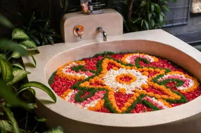 a sink with a flower arrangement in it at Bahira Lovely 1 BR Grand Pool Villa With Bathtub in Legian