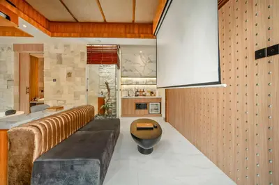 a living room with a couch and a table at Evelyn Grand 1 BR Private Pool Villa With Bathtub in Legian