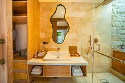 a bathroom with a sink and a shower at Evelyn Grand 1 BR Private Pool Villa With Bathtub in Legian