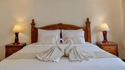 two towel swans sitting on top of a bed at New 2BR Mahaprada Private Pool in Seminyak in Seminyak