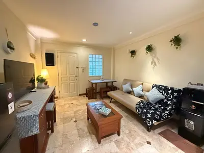 a living room with a couch and a table at Apartment at Jayakarta Residence 6214 in Seminyak