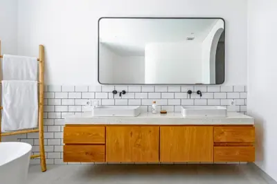 a bathroom with two sinks and a mirror at Ashlyn Elegant 4 BR Private Pool Villa in Canggu