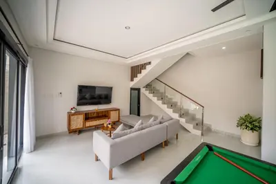 a living room with a pool table at Villa Amani Seminyak in Seminyak