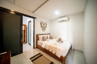a bedroom with a bed in a room at Villa Amani Seminyak in Seminyak