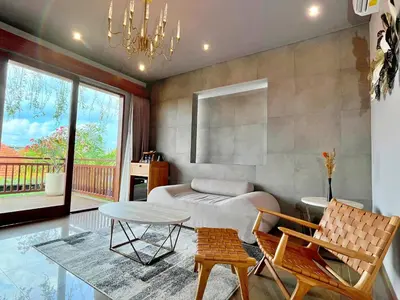 a living room with a couch and a table at Villa Nishiki 5-Bedroom Private Villa in Seminyak in Seminyak