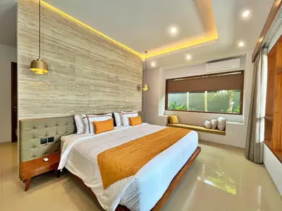 a bedroom with a large bed and a window at Villa Nishiki 5-Bedroom Private Villa in Seminyak in Seminyak