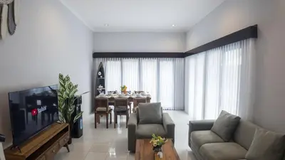 a living room with a couch and a table at 3BR Private Pool Villa in Central Seminyak - Walk to Cafés & Shops in Seminyak