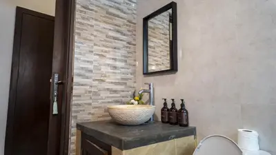 a bathroom with a sink and a mirror at 3BR Private Pool Villa in Central Seminyak - Walk to Cafés & Shops in Seminyak