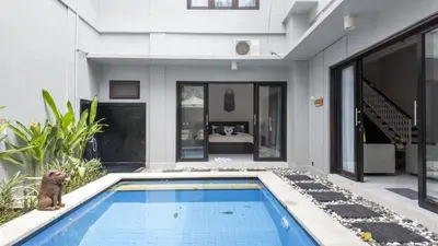 a house with a swimming pool in the yard at 3BR Private Pool Villa in Central Seminyak - Walk to Cafés & Shops in Seminyak