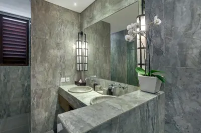 a bathroom with a sink and a mirror at Villa Abagram Anam in Seminyak