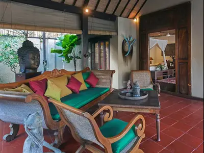 a living room with a couch and a table at Luxury 6-bedroom Villa in Seminyak in Seminyak