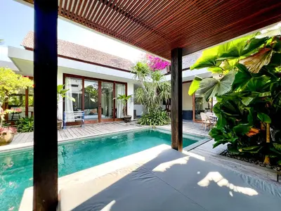 a swimming pool in a villa with a house at Umalas cozy 3 Bedrooms private pool villa in Kerobokan