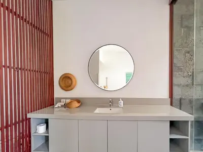 a bathroom with a sink and a mirror at Umalas cozy 3 Bedrooms private pool villa in Kerobokan